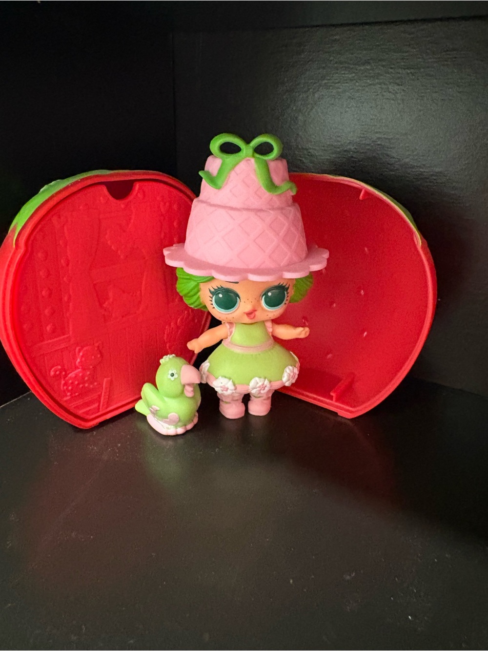L.O.L. Surprise! Strawberry Shortcake Doll with Green Parrot and Red Heart Case